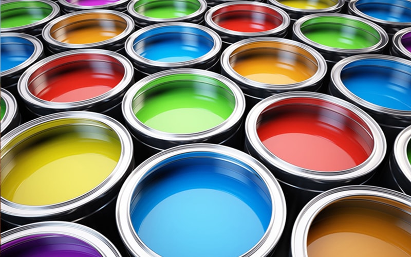 open cans of paints in many colors